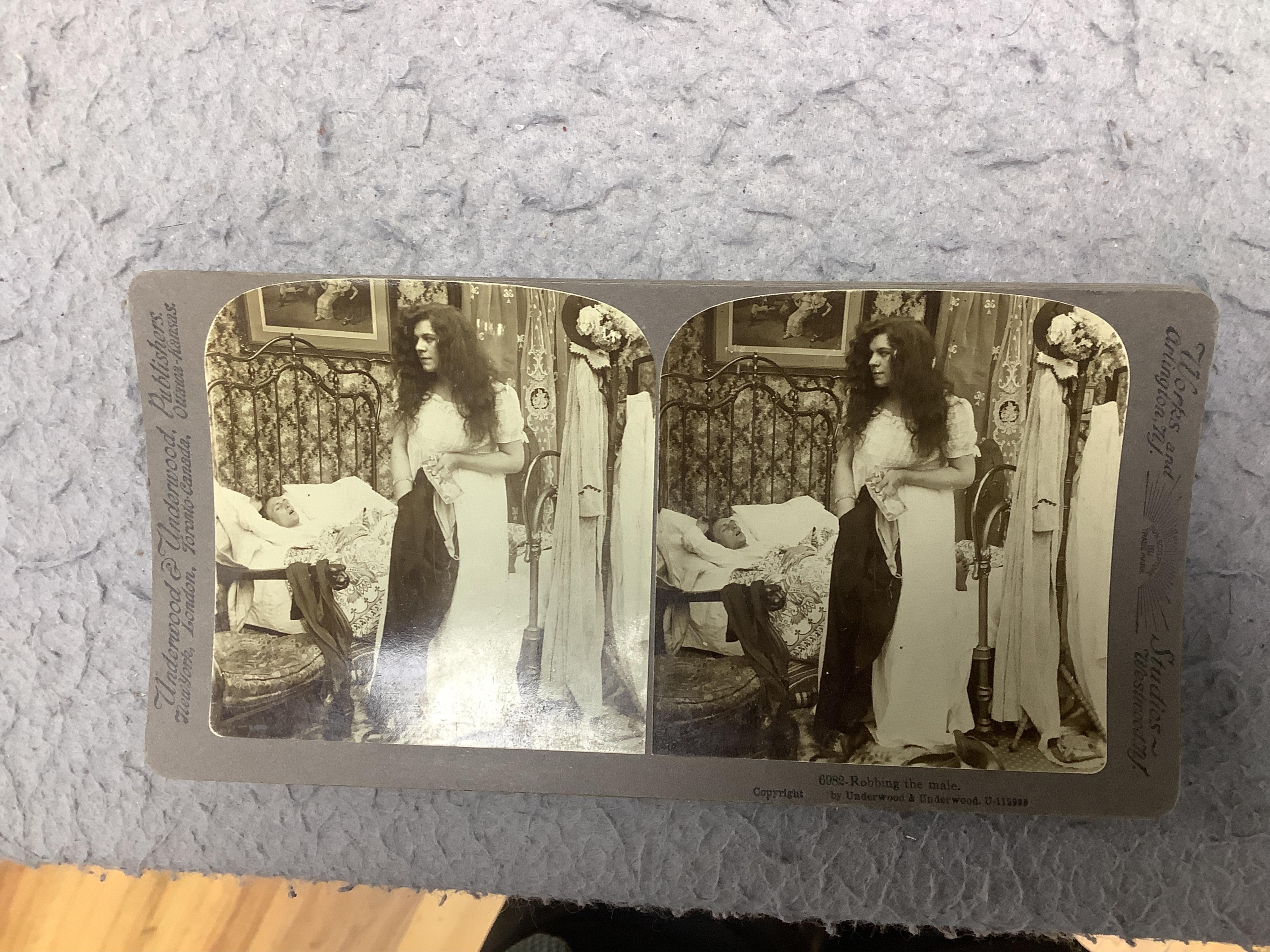 A stereoscope viewer with a collection of comical viewing cards. Condition - cards - fair/good, viewer - poor